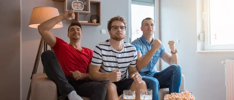 friends watching sport game